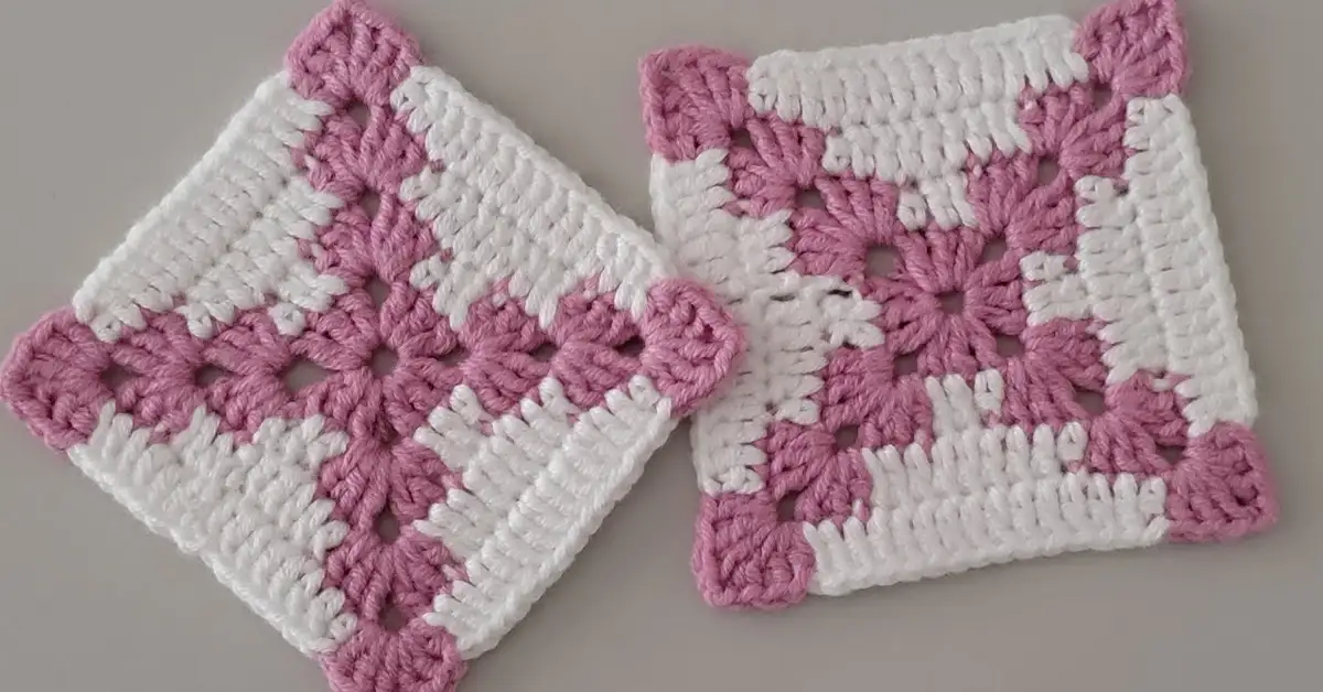 Two-toned crochet granny square motif with green and yellow yarn.