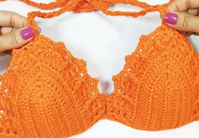 A free crochet bikini top pattern for beginners, featuring a simple and stylish design with a fan stitch detail.