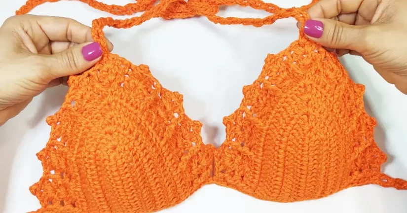 A free crochet bikini top pattern for beginners, featuring a simple and stylish design with a fan stitch detail.