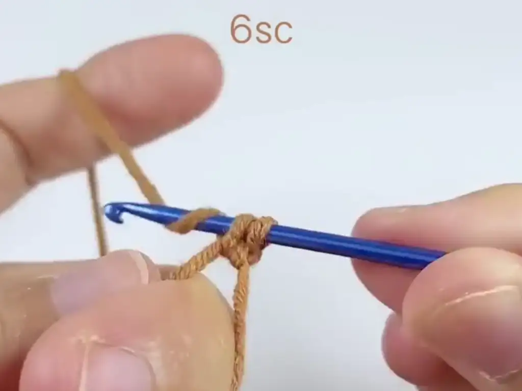 Beginning the crochet sunflower centerpiece with a magic ring