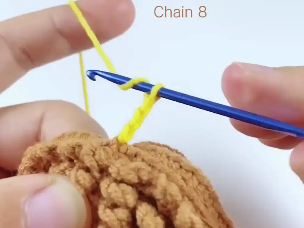 First layer of petals for the crochet sunflower, forming a solid base.