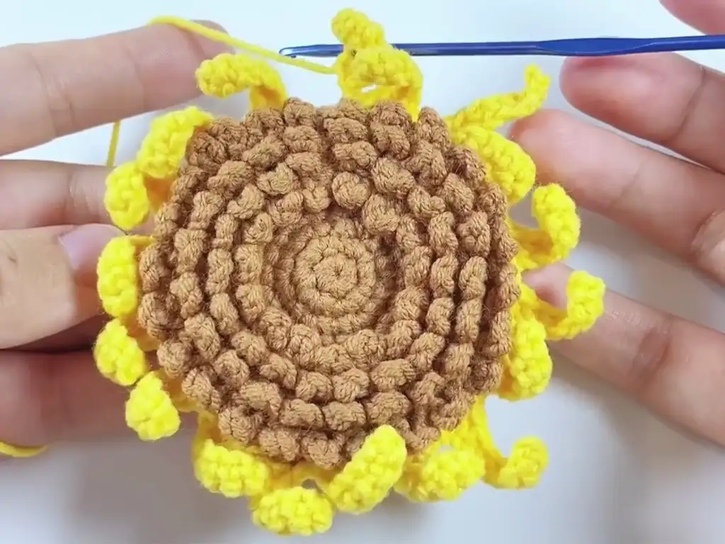 First layer of petals for the crochet sunflower, forming a solid base.