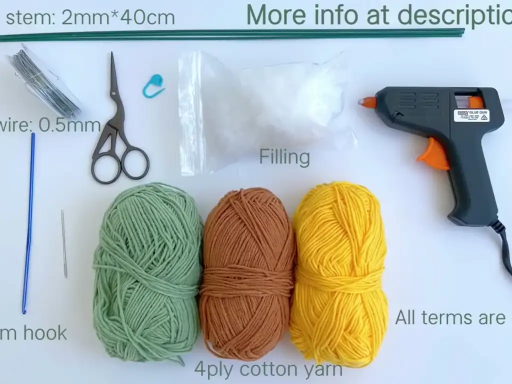 Materials needed for crochet sunflower including yarn, hook, scissors, and needle.