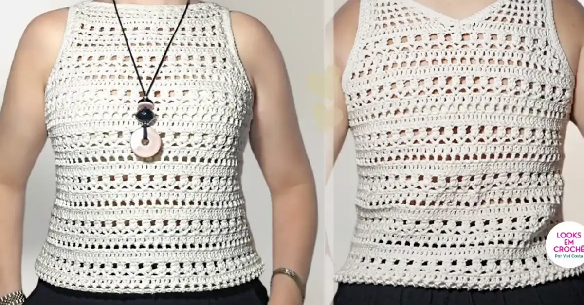 Woman wearing a stylish, handmade crochet blouse for summer.