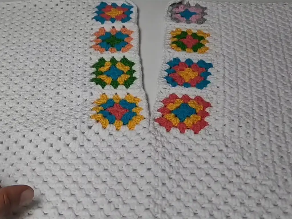 A close-up image of the crochet crop top body section being worked, showcasing the stitch pattern and shaping.