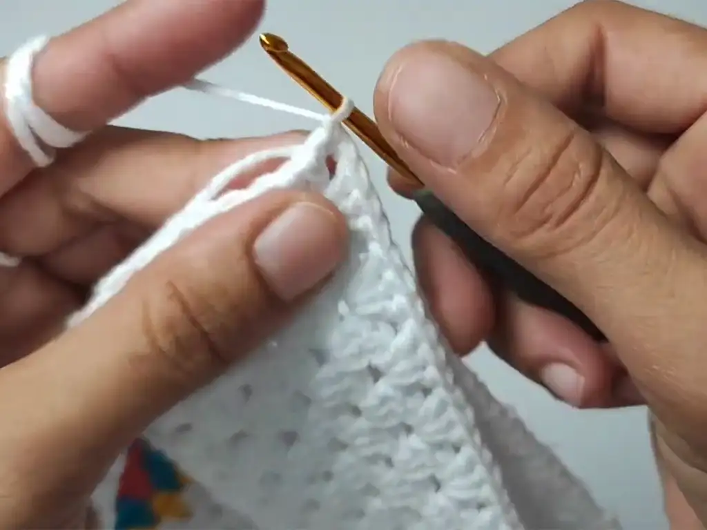 A step-by-step image showing how to join the granny squares to create the V-neck of the crochet crop top.