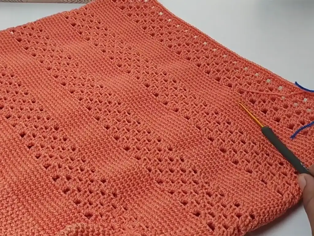 The body of our macrame bag is taking shape! The repeating pattern creates a visually appealing design.