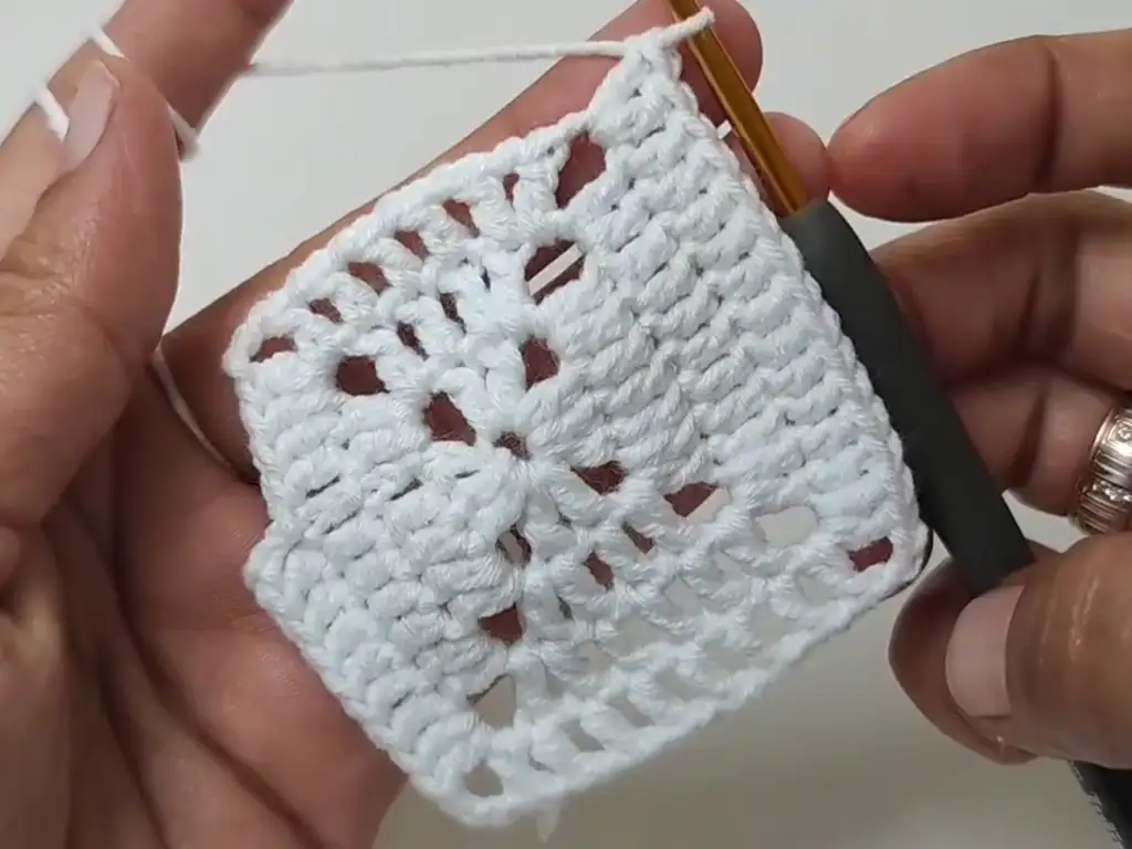 You're almost there! Your crochet square motif is ready for a contrasting border.