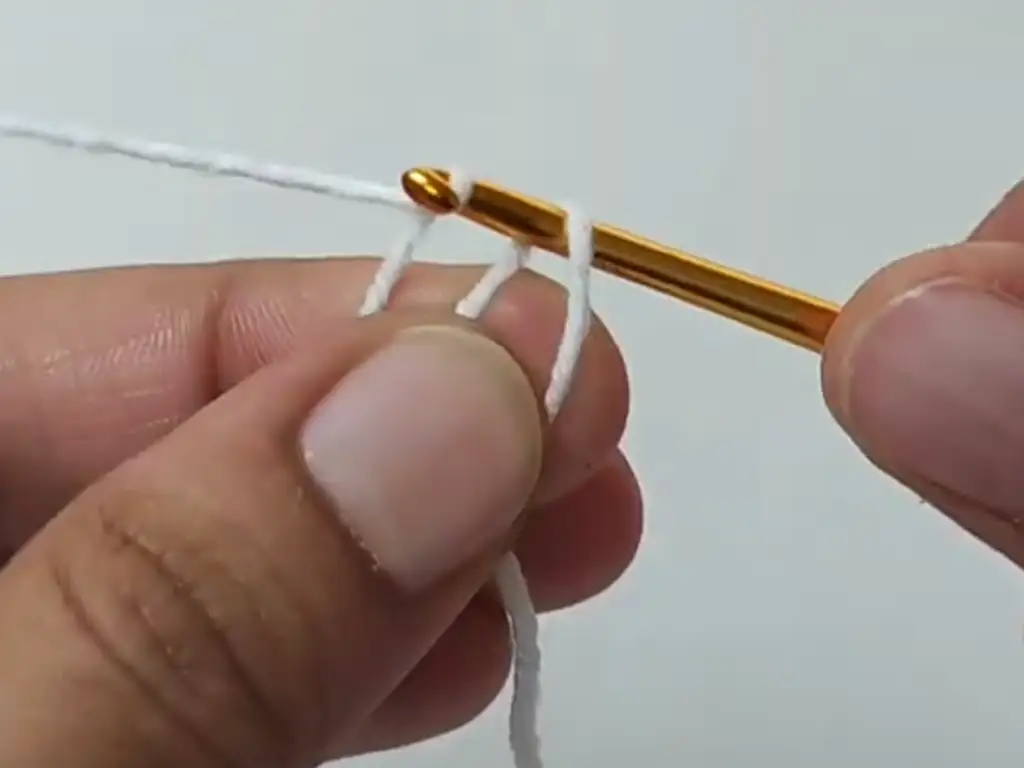 Begin your crochet square motif by creating a secure magic ring.