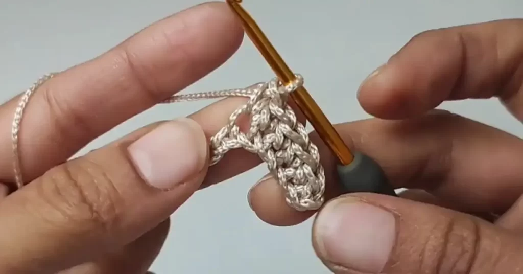 Adding handles to the crochet tote bag with single crochet stitches.