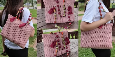 Stylish crochet macrame bag with wooden handles, perfect for the beach or market.