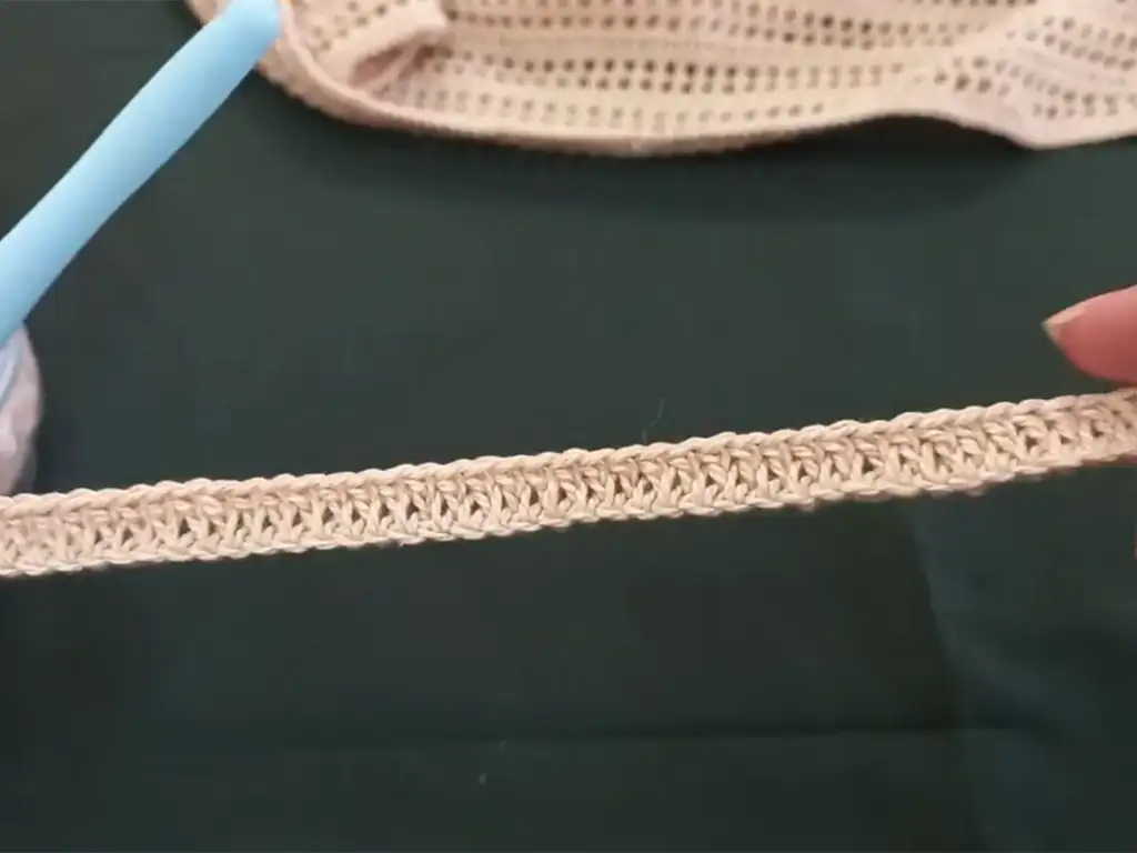 Close-up of the double crochet stitch pattern used for the easy crochet blouse, showing the open, lacy texture.