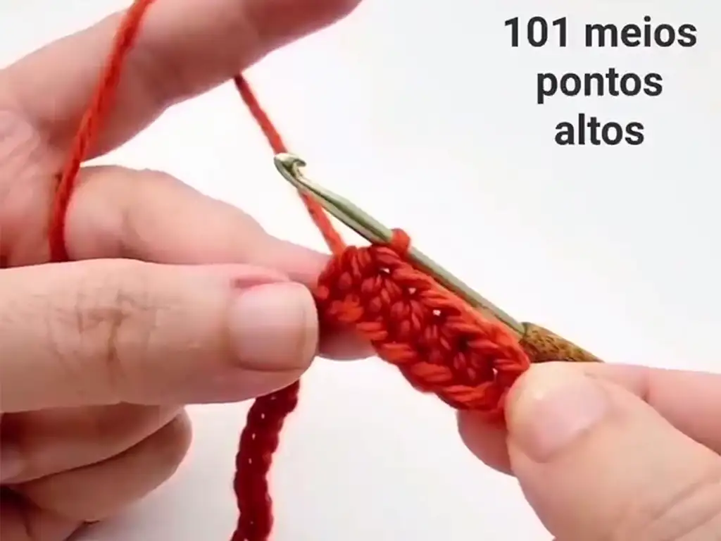 Working half double crochet stitches along a row of the headband.