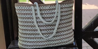 Stylish cream and brown crochet tote bag with macrame rope handles, perfect for summer.
