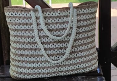 Stylish cream and brown crochet tote bag with macrame rope handles, perfect for summer.