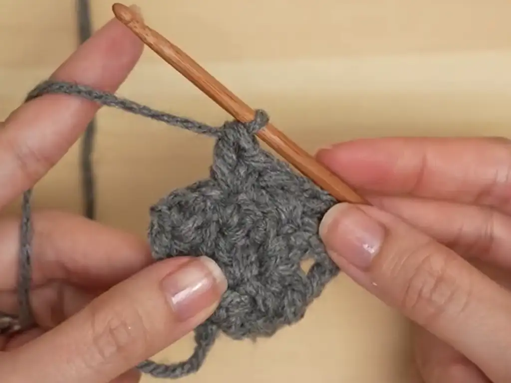 Mastering the Suzette stitch: A key stitch for this textured crochet puff sleeve top.