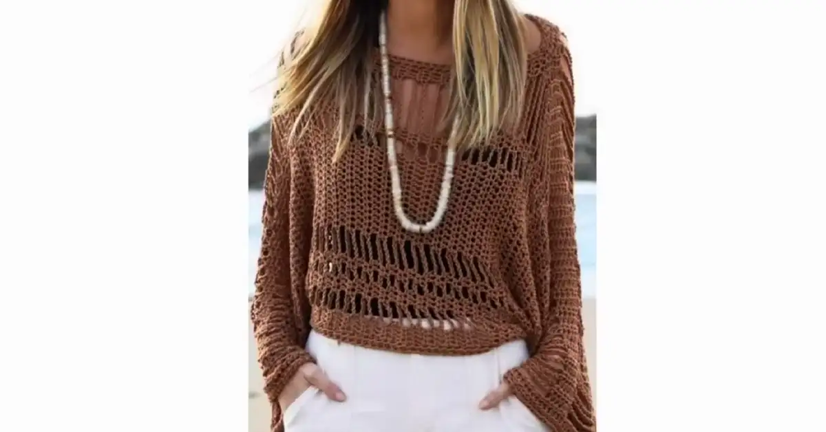 Stylish woman wearing a brown crochet tunic with a boat neckline and open sides, perfect for summer.