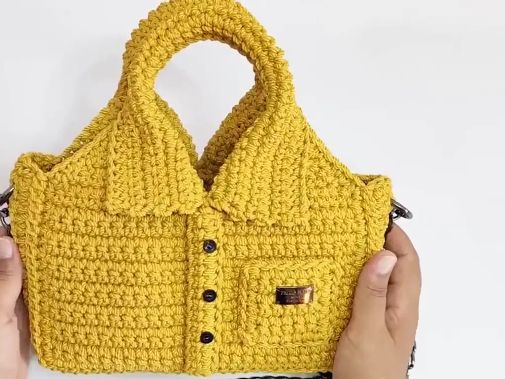 Close-up view of the textured stitches and button detail.