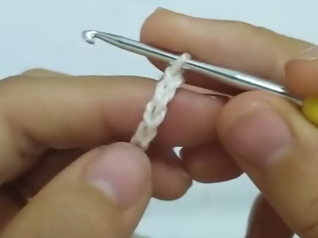 Beginner crocheter learning the foundation chain stitch.