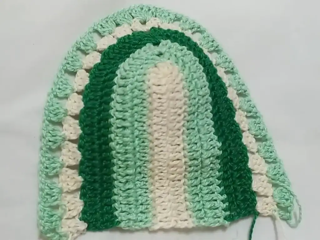 One finished crochet cropped top cup, ready to be joined.