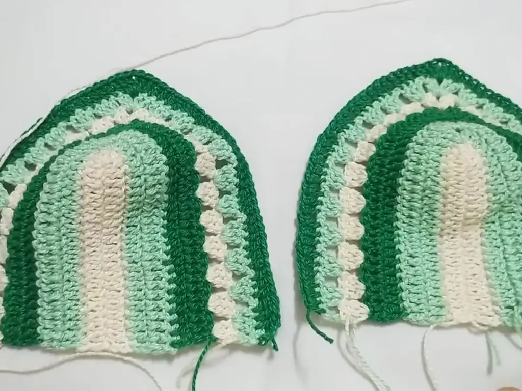 Two crochet cropped top cups joined together at the center.