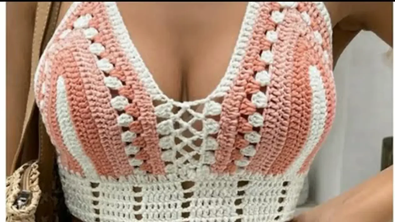 A finished crochet cropped top being worn, showcasing its style.