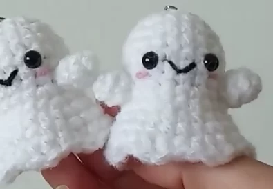Two adorable crocheted ghost keychains, perfect for Halloween!