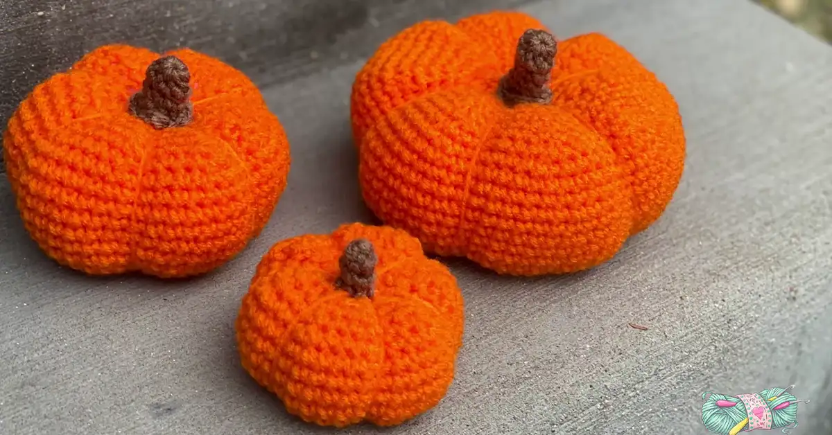 Three handmade crochet pumpkins in various sizes, perfect for fall decorating.