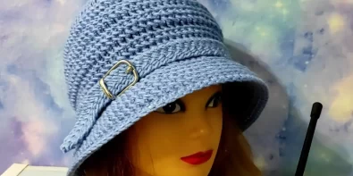 Blue crochet cloche hat with brim, perfect for fall and winter.