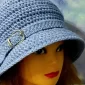 Blue crochet cloche hat with brim, perfect for fall and winter.