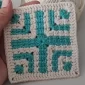 Finished Geometric Crochet Square in cream and turquoise. A beautiful granny square variation.