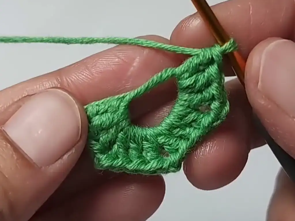 Creating a chain space in the crochet granny square for the Christmas tree.