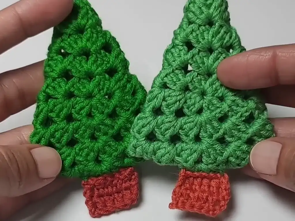 Two completed crochet Christmas tree ornaments, one with a tighter seam.