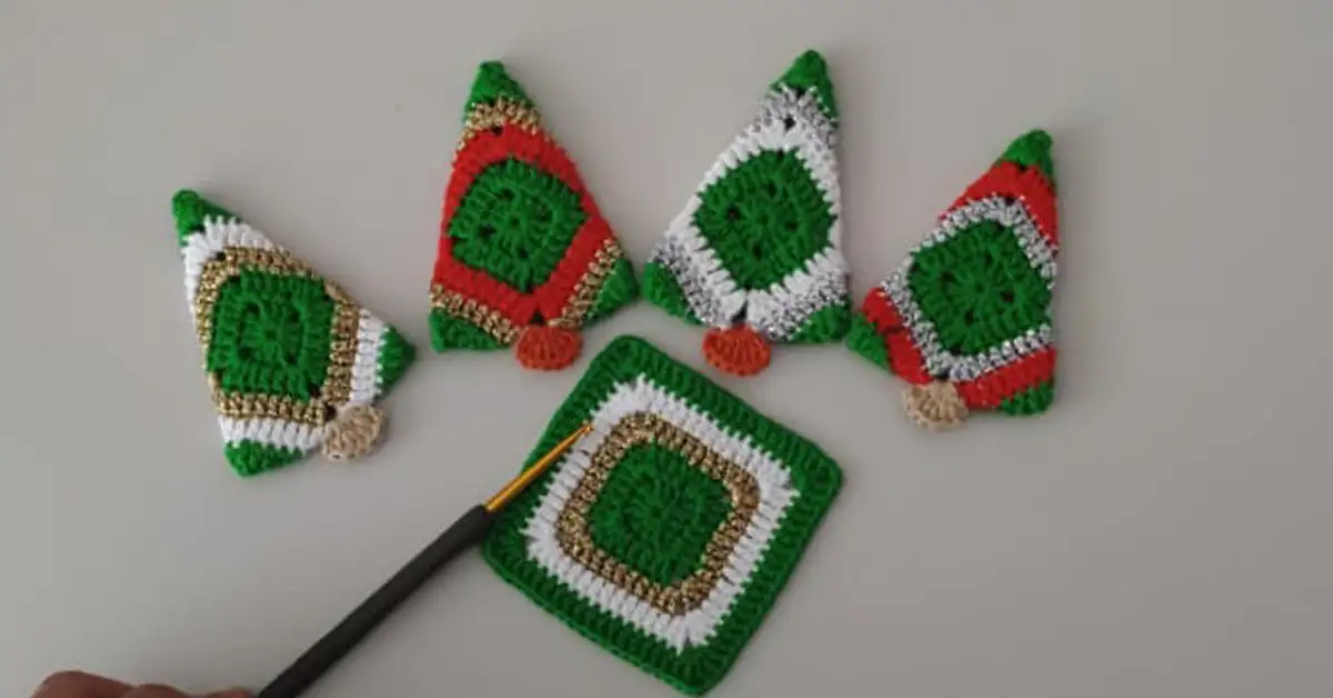 Finished crochet Christmas trees and a flat square motif with a crochet hook, demonstrating the project stages.