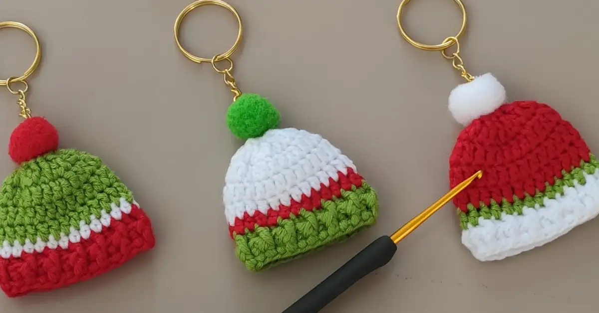 Festive crocheted Santa hat keychains in red, white, and green. Perfect Christmas gifts!