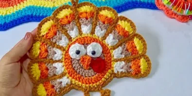 Adorable finished crochet turkey, perfect for Thanksgiving decor! Easy DIY project.