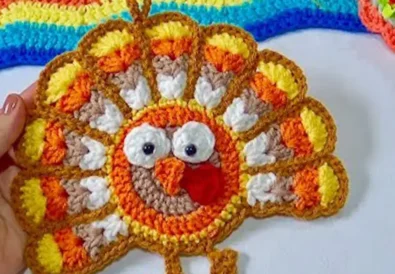 Adorable finished crochet turkey, perfect for Thanksgiving decor! Easy DIY project.