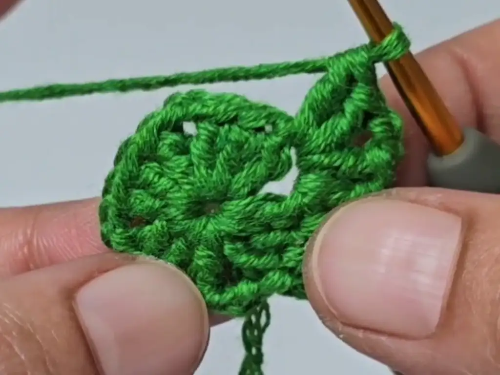Close-up of the beginning stitches of the crochet tree pattern after completing the magic ring.