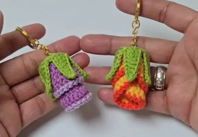 Two crochet rosebud keychains, showing color variations.