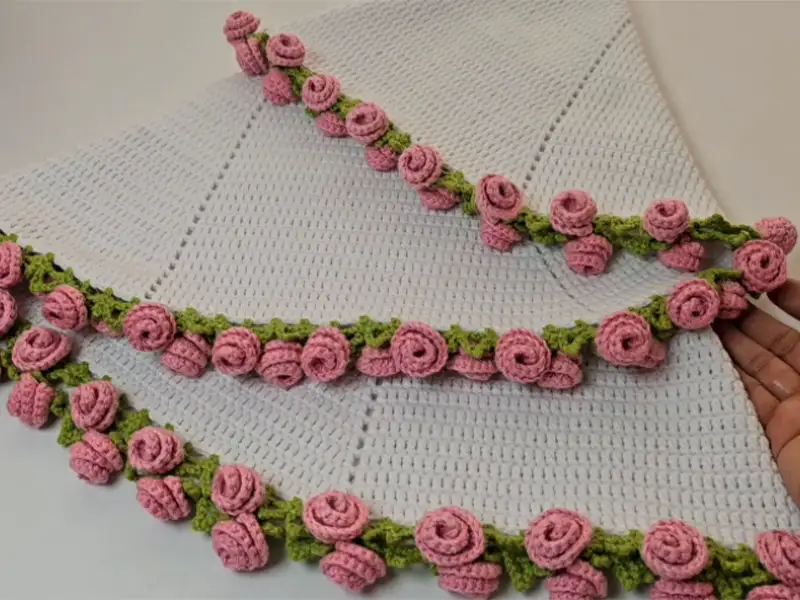 Crochet rose blanket close-up showing detailed rose motifs