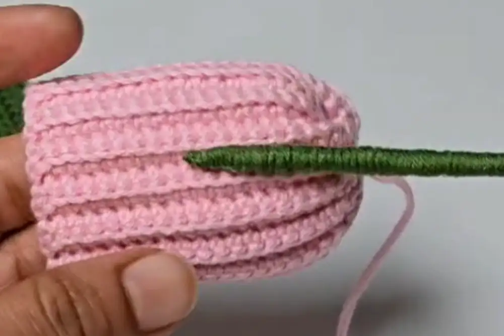Inserting the wrapped stem into the crochet tulip