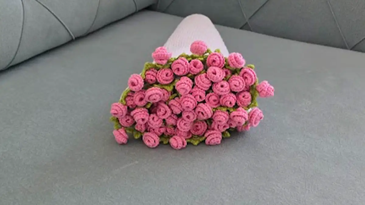 Finished pink rose bouquet blanket rolled up for presentation