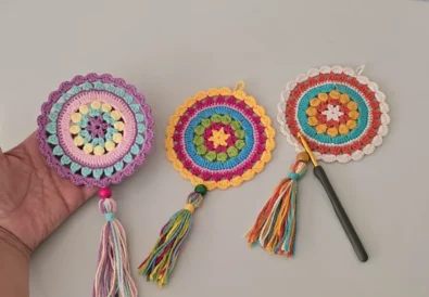 Completed easy crochet mandala hanging decoration in vibrant colors