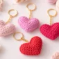 Easy crochet heart keychain pattern in pink and red with gold keyring, handmade beginner-friendly gift idea