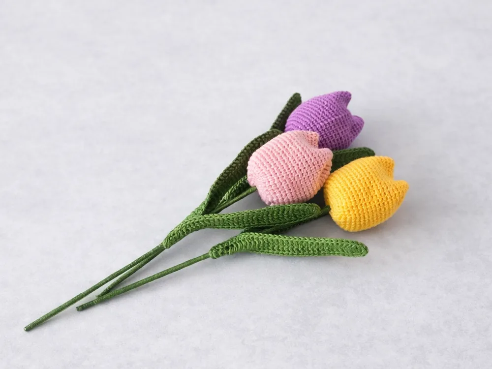 easy crochet tulip bouquet finished project with three handmade crochet tulips

