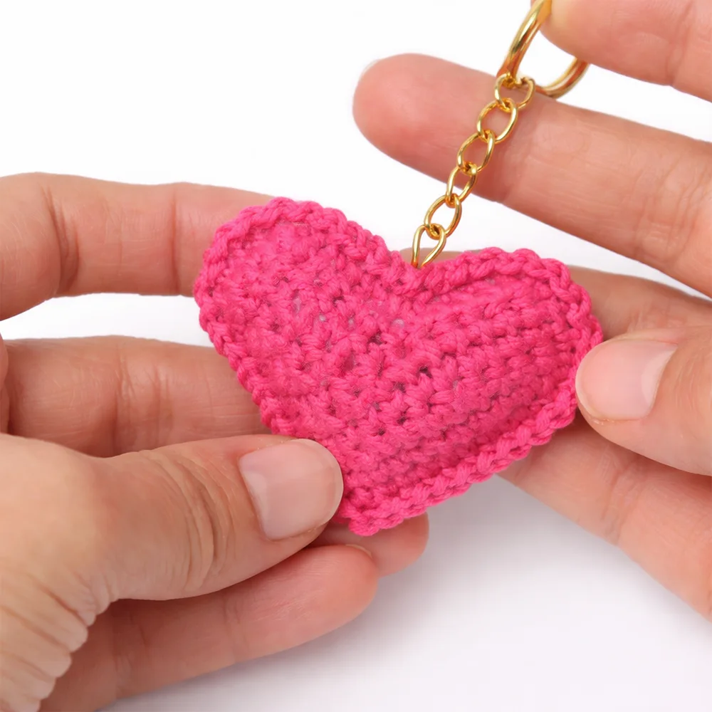 finished crochet heart keychain close up with gold keyring