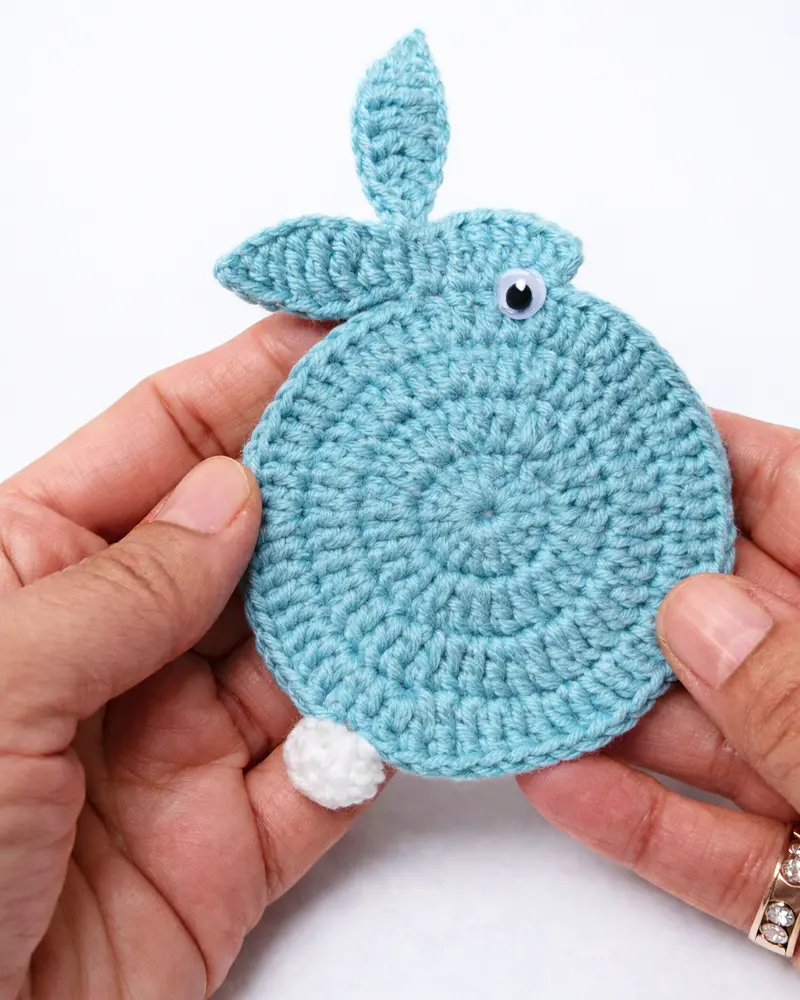 Cute crochet bunny coaster finished result in blue yarn for beginners