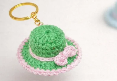 Easy crochet hat keychain made with green and pink cotton yarn