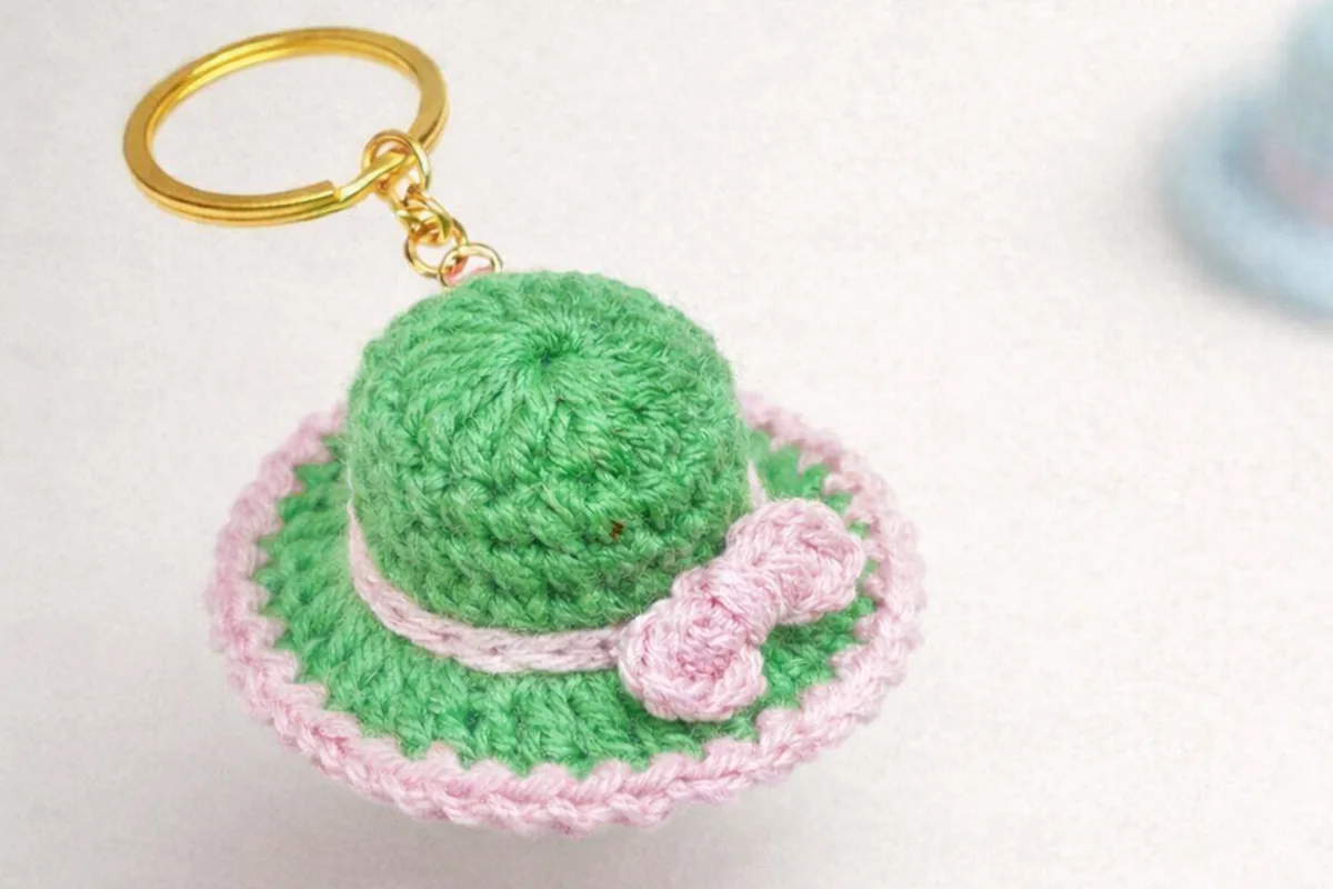 Easy crochet hat keychain made with green and pink cotton yarn