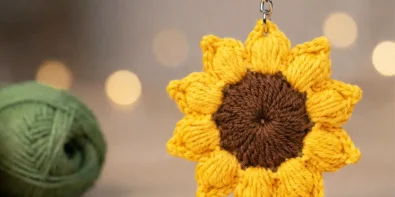 easy crochet sunflower keychain pattern with puff stitch petals and brown center for beginners